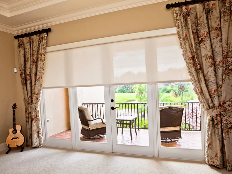Motorized Lutron shades with Schumacher drapery panels in a Jupiter FL home | PaperWorks Plus