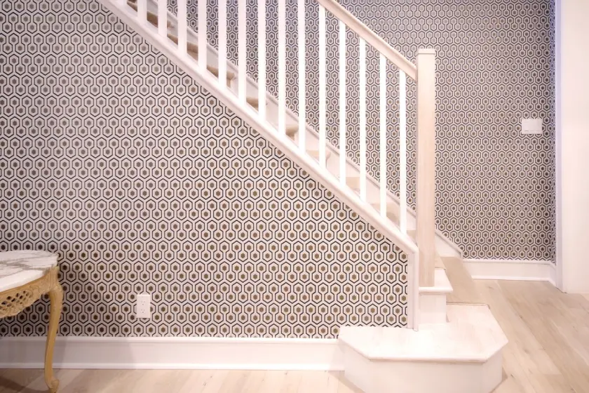 Geometric Wallpaper Installation on a Staircase Accent Wall | PaperWorks Plus, Jupiter FL