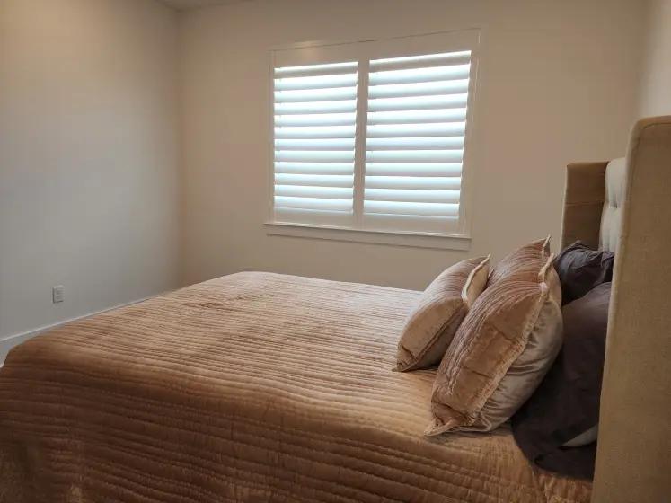 Custom Plantation Shutters in a Bedroom | PaperWorks Plus, Jupiter FL