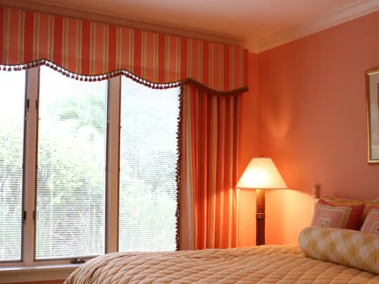 Coral Bedroom with Striped Scalloped Valance and Drapery with Ball Trim | PaperWorks Plus, Jupiter FL