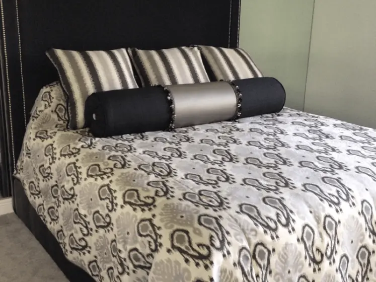 Contemporary Bedding: Bedspread with Ikat Design Fabric, Square Pillows, Bolster Pillow with Contrasting Colors | PaperWorks Plus, Jupiter FL