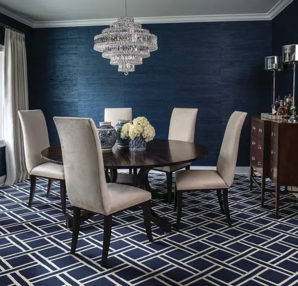 A striking marine colored geometric patterned nylon carpet in a contemporary dining room from Stanton Carpet | PaperWorks Plus, Jupiter FL